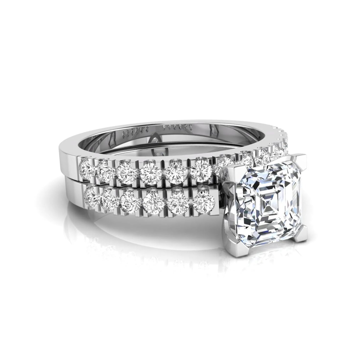 Princess cut lab grown diamond solitaire bridal ring set featuring a four-prong engagement ring with a matching pavé diamond wedding band in white gold.