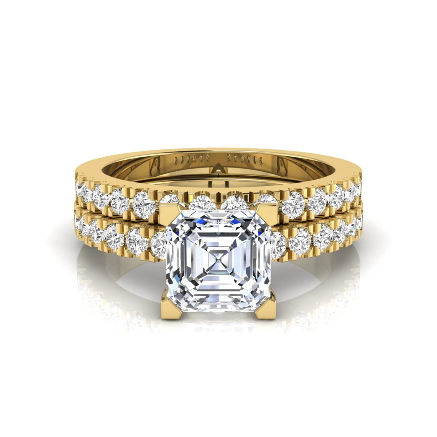 Princess cut lab grown diamond solitaire bridal ring set featuring a four-prong engagement ring with a matching pavé diamond wedding band in yellow gold.
