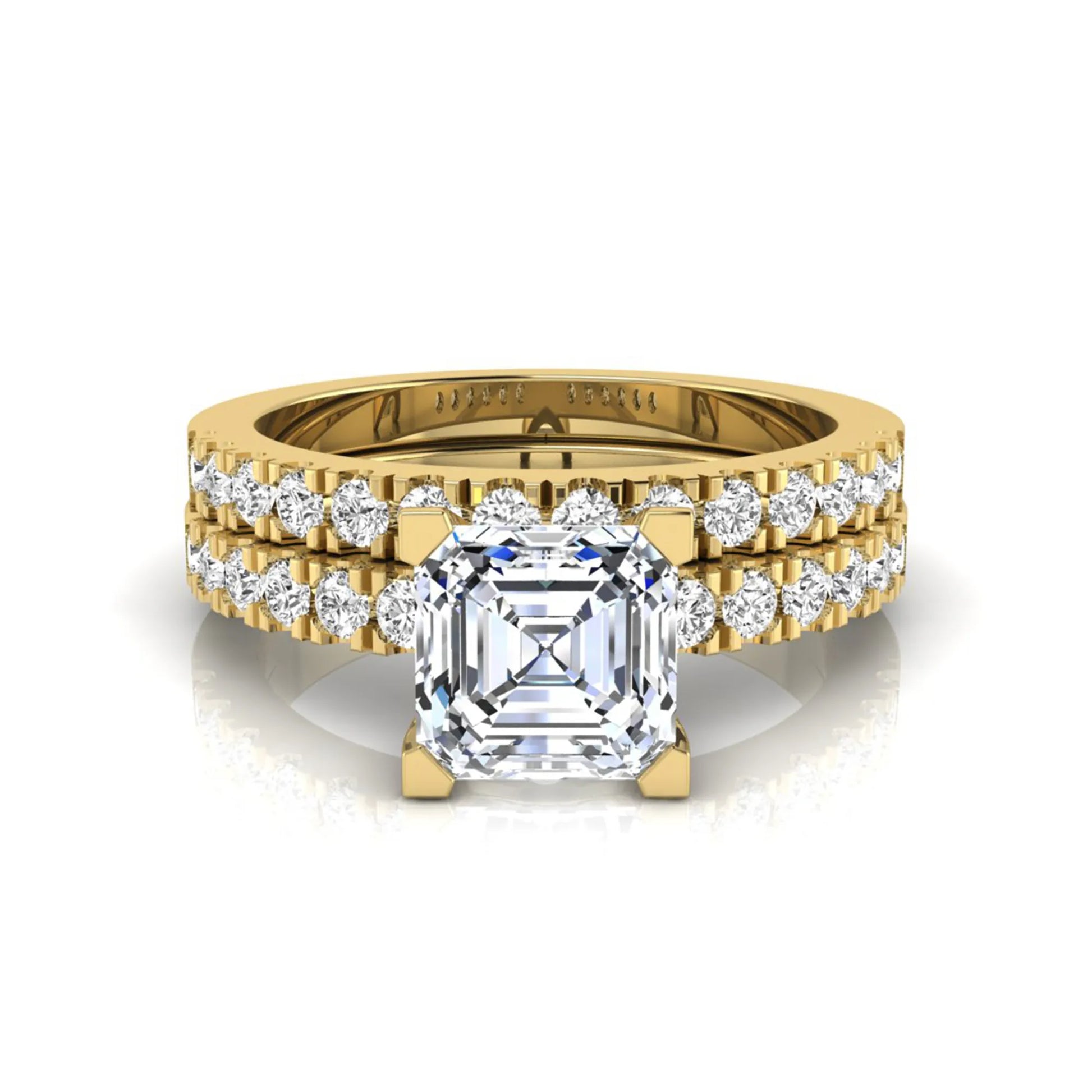Princess cut lab grown diamond solitaire bridal ring set featuring a four-prong engagement ring with a matching pavé diamond wedding band in yellow gold.