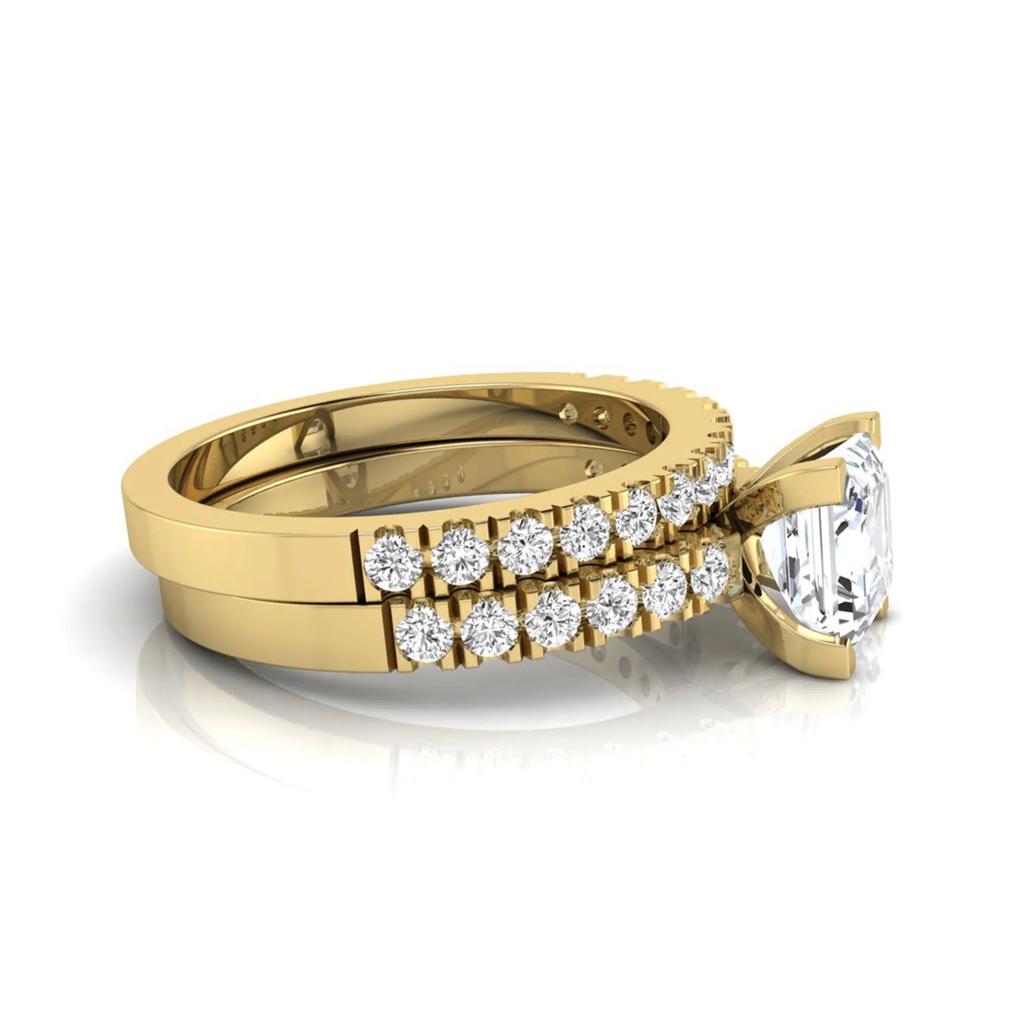 Princess cut lab grown diamond solitaire bridal ring set featuring a four-prong engagement ring with a matching pavé diamond wedding band in yellow gold.