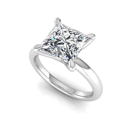 Princess cut lab grown diamond engagement ring featuring a 1.96 carat center diamond in a classic four-prong cathedral solitaire setting with a polished white gold tone band.
