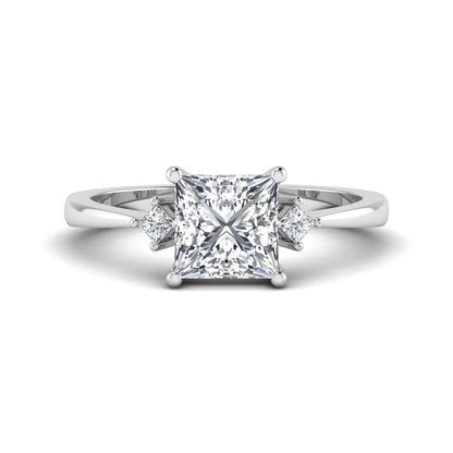 Princess cut lab grown diamond three stone engagement ring featuring a four-prong center diamond with princess cut side stones in white gold.