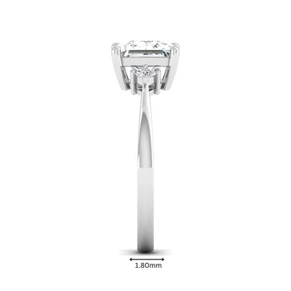 Princess cut lab grown diamond three stone engagement ring featuring a four-prong center diamond with princess cut side stones in white gold.