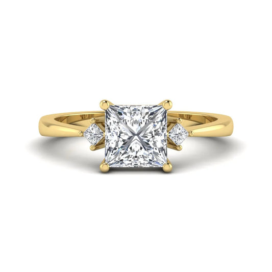 Princess cut lab grown diamond three stone engagement ring featuring a four-prong center diamond with princess cut side stones in yellow gold.