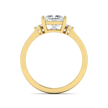 Princess cut lab grown diamond three stone engagement ring featuring a four-prong center diamond with princess cut side stones in yellow gold.