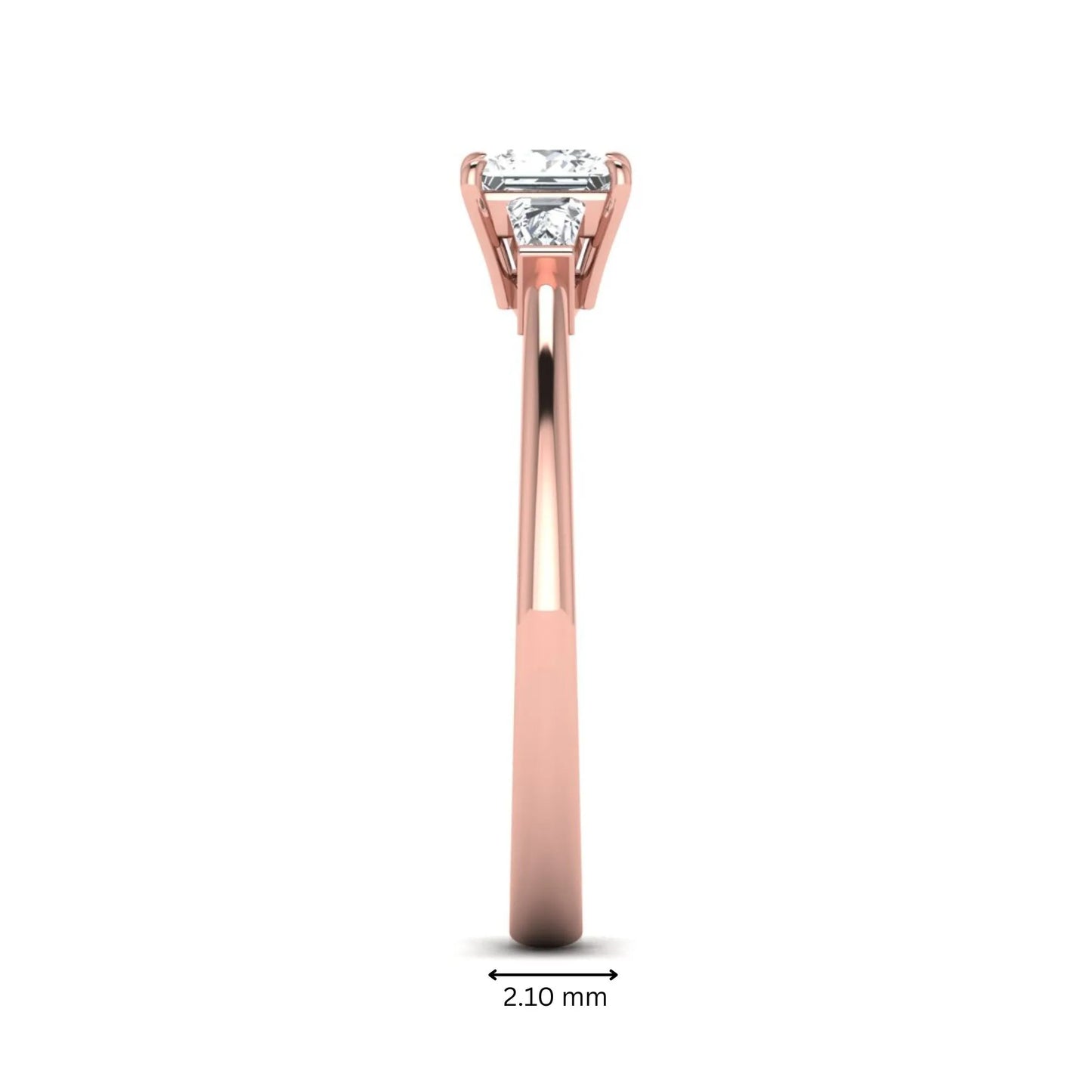 Princess cut lab grown diamond three stone engagement ring with tapered baguette side diamonds in a four-prong setting and rose gold tone band.