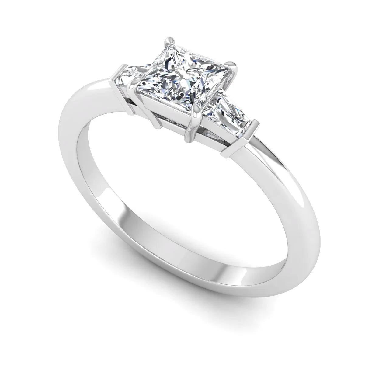 Princess cut lab grown diamond three stone engagement ring with tapered baguette side diamonds in a four-prong setting and white gold tone band.