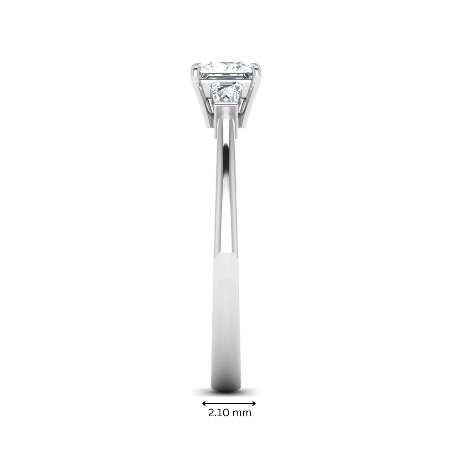 Princess cut lab grown diamond three stone engagement ring with tapered baguette side diamonds in a four-prong setting and white gold tone band.