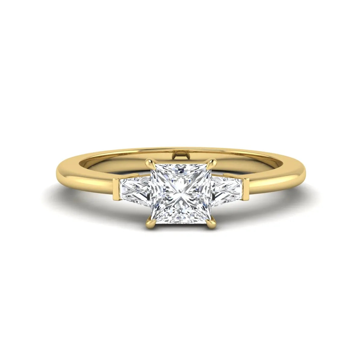 Princess cut lab grown diamond three stone engagement ring with tapered baguette side diamonds in a four-prong setting and yellow gold tone band.