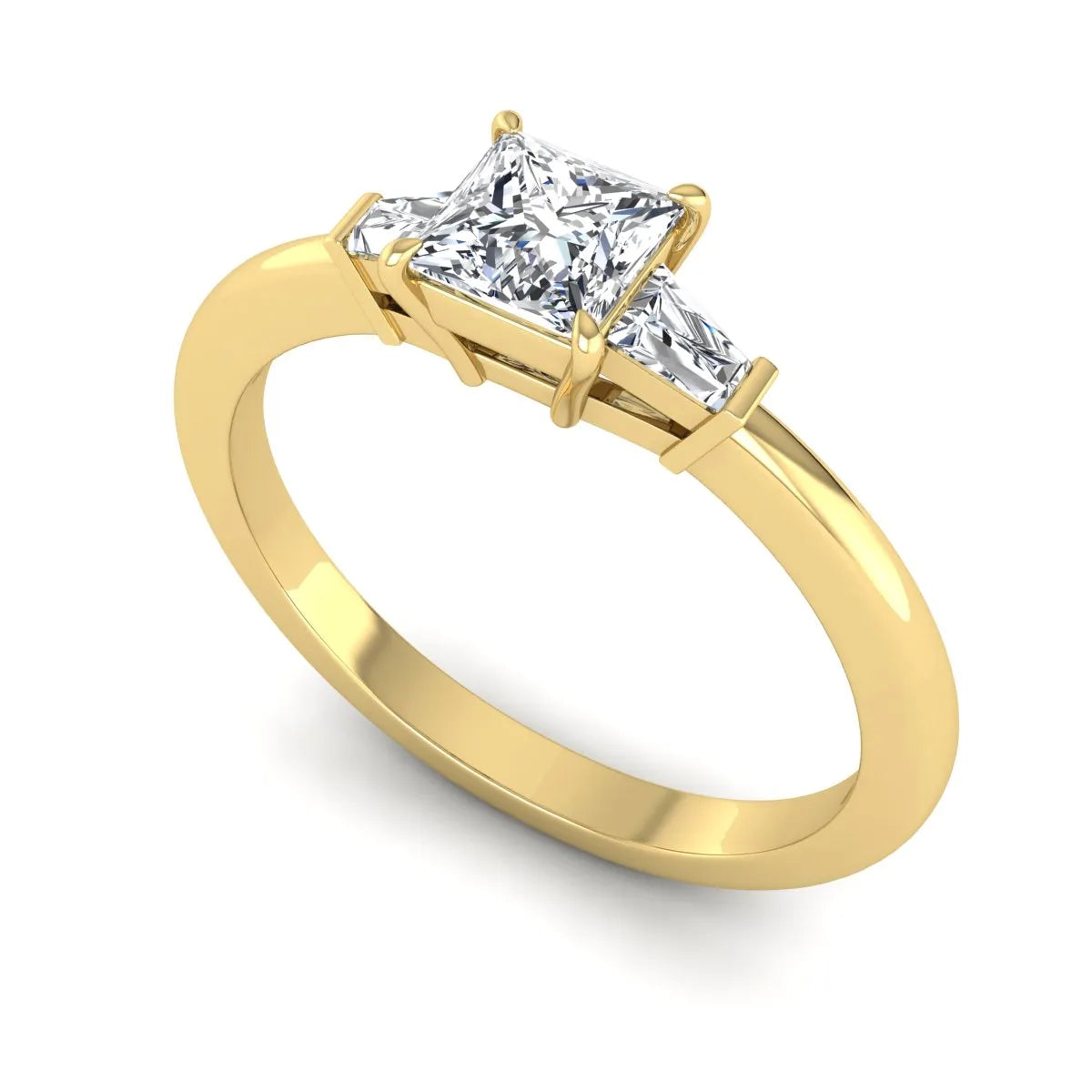 Princess cut lab grown diamond three stone engagement ring with tapered baguette side diamonds in a four-prong setting and yellow gold tone band.