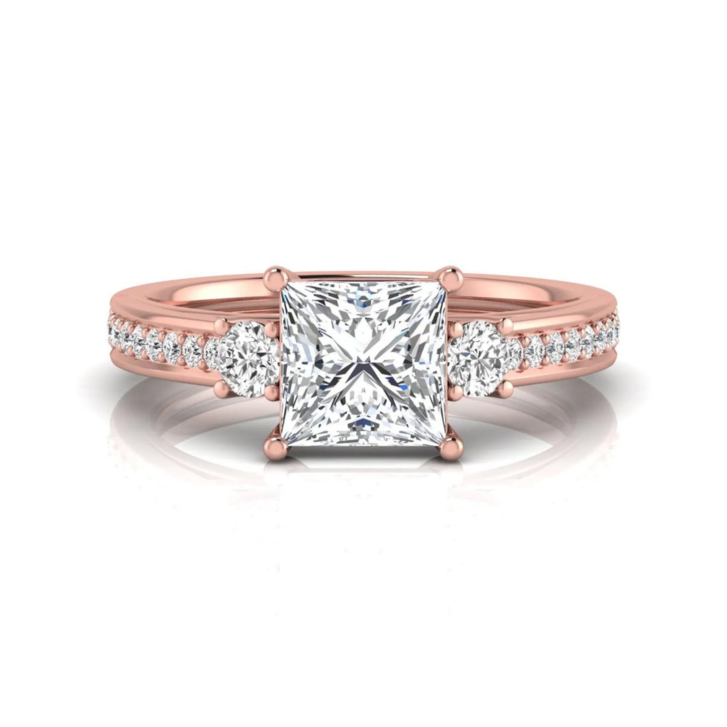 Princess cut three stone lab grown diamond engagement ring featuring a princess center diamond, round side diamonds, and pavé band in Rose metal tone.