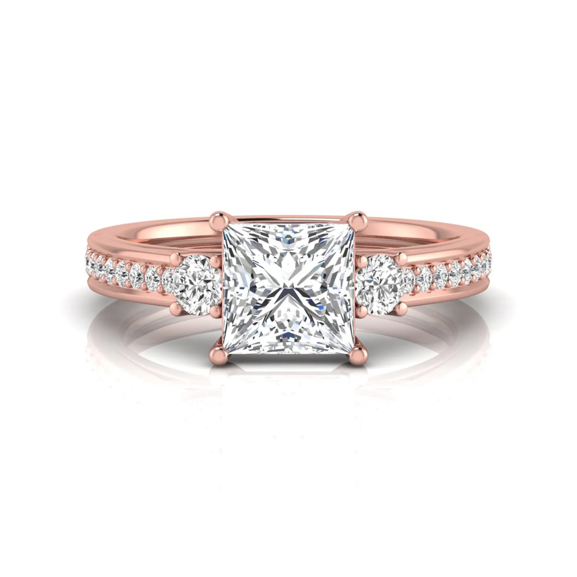 Princess cut three stone lab grown diamond engagement ring featuring a princess center diamond, round side diamonds, and pavé band in Rose metal tone.