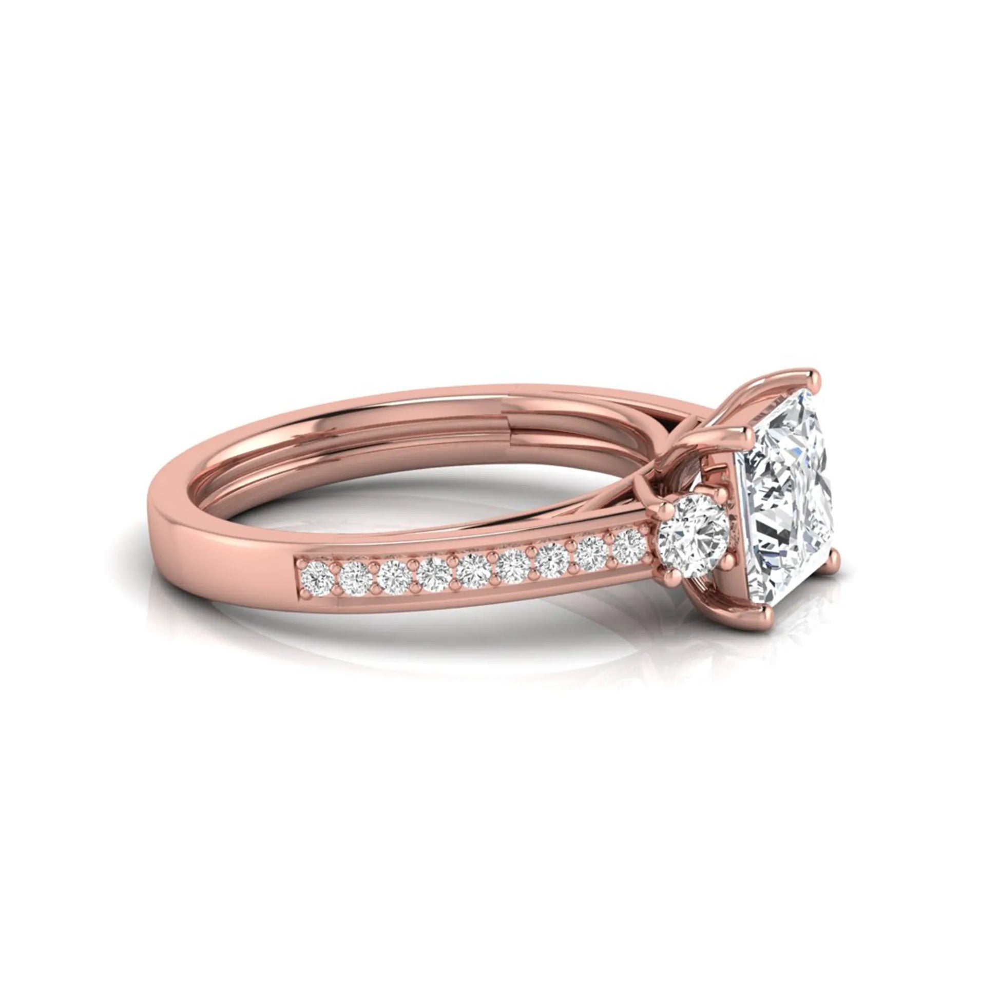 Princess cut three stone lab grown diamond engagement ring featuring a princess center diamond, round side diamonds, and pavé band in Rose metal tone.