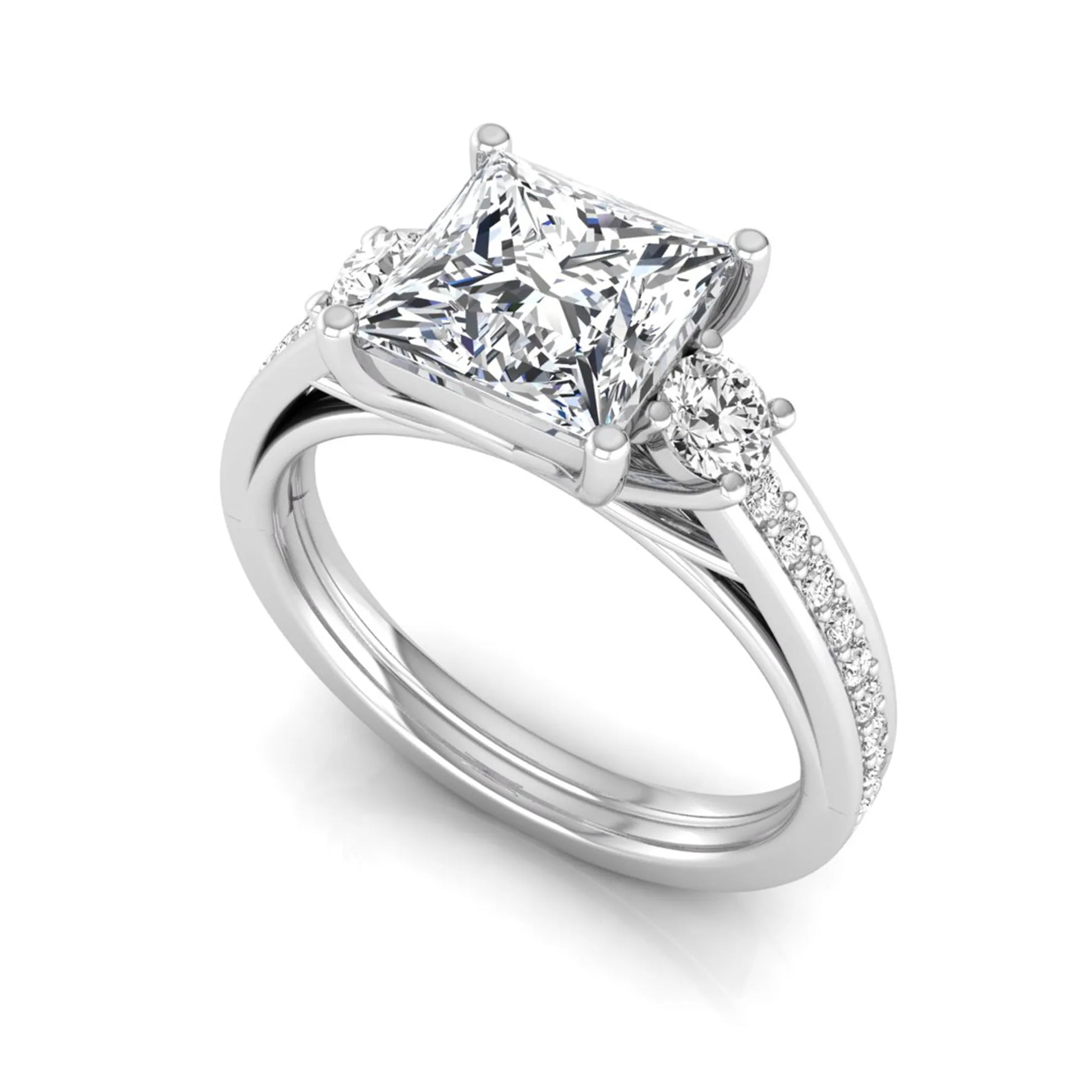 Princess cut three stone lab grown diamond engagement ring featuring a princess center diamond, round side diamonds, and pavé band in White metal tone.