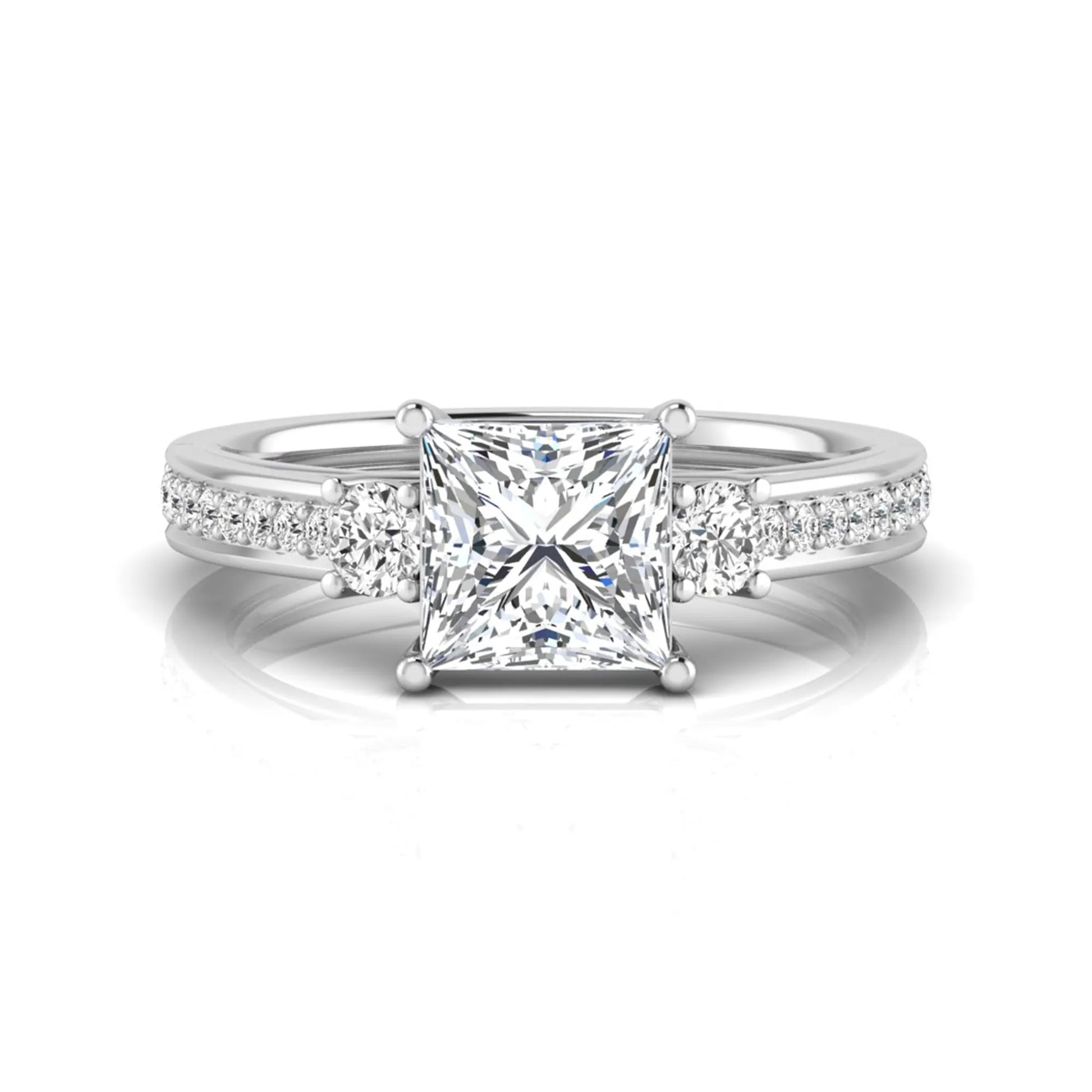 Princess cut three stone lab grown diamond engagement ring featuring a princess center diamond, round side diamonds, and pavé band in White metal tone.