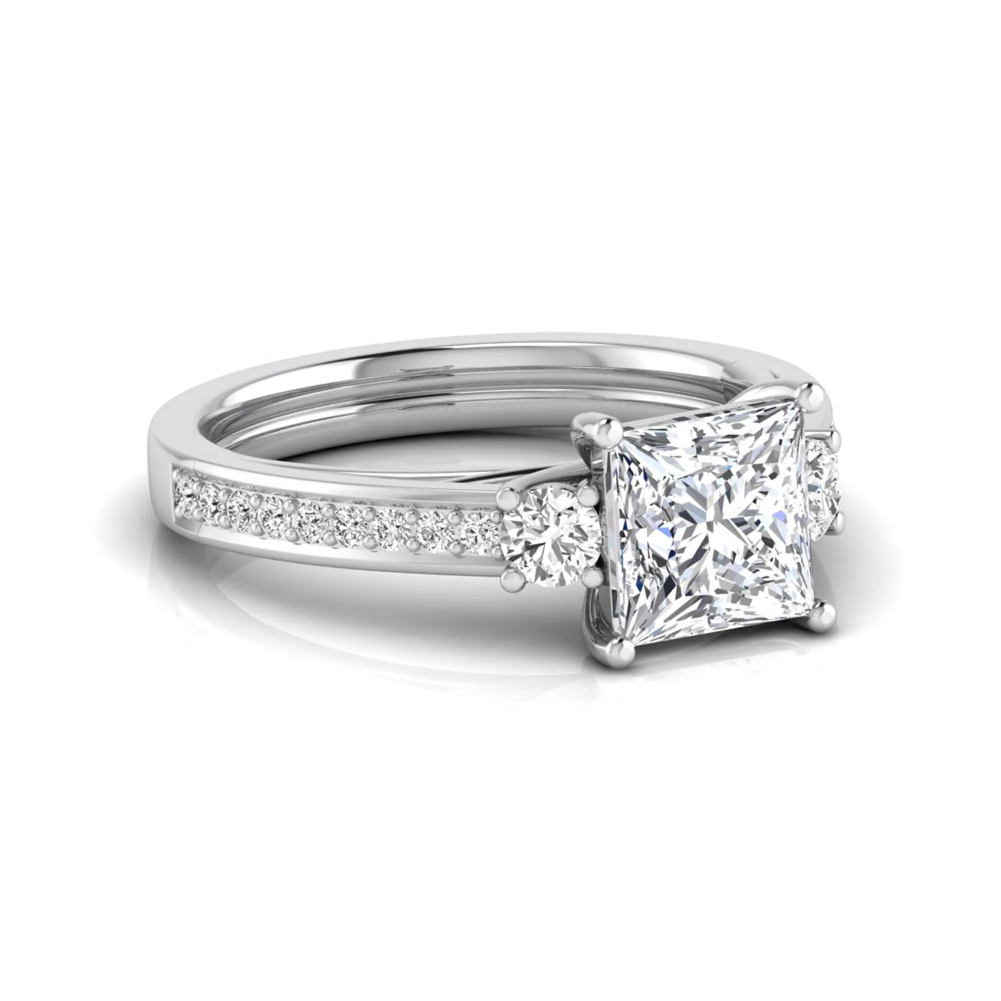 Princess cut three stone lab grown diamond engagement ring featuring a princess center diamond, round side diamonds, and pavé band in White metal tone.