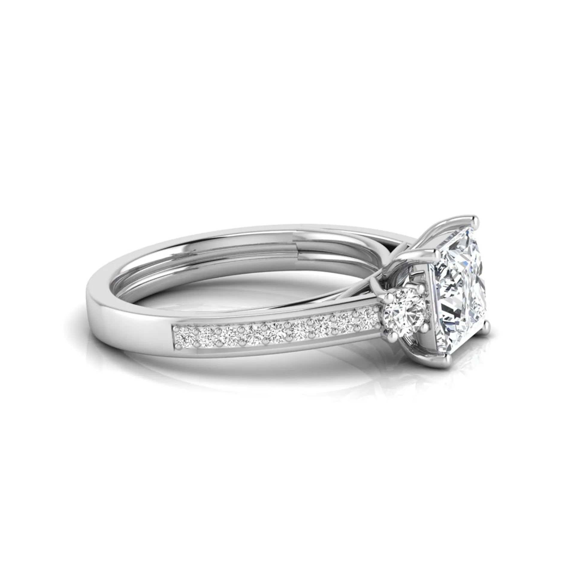 Princess cut three stone lab grown diamond engagement ring featuring a princess center diamond, round side diamonds, and pavé band in White metal tone.