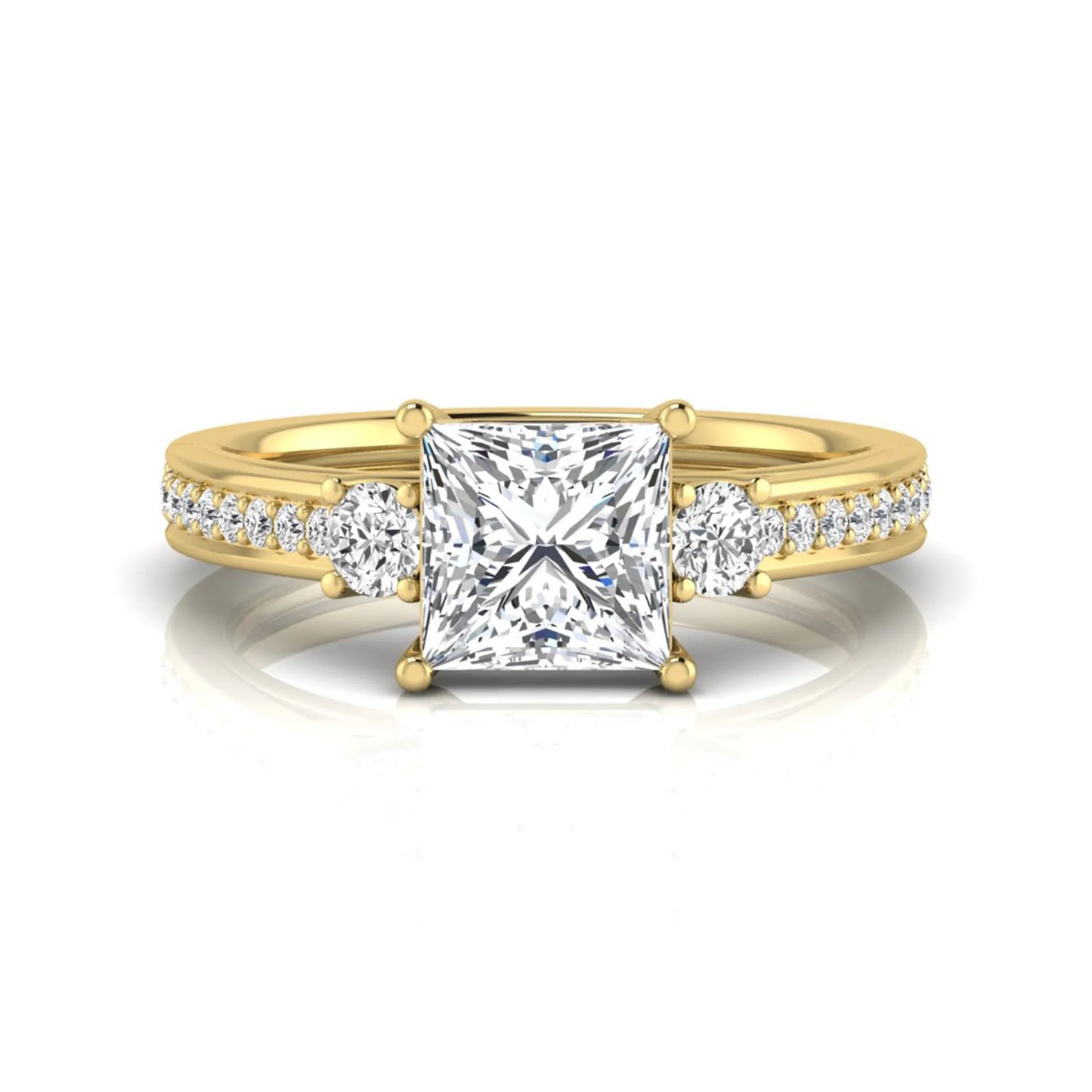 Princess cut three stone lab grown diamond engagement ring featuring a princess center diamond, round side diamonds, and pavé band in yellow metal tone.