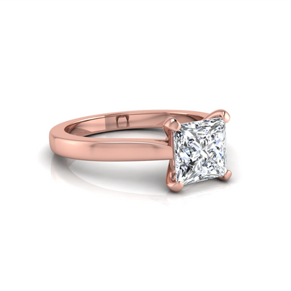 Rose-gold ring with a diamond on a white background