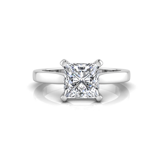 Diamond ring with three stones on a white background
