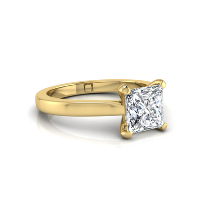 yellow-Gold ring with a princess-cut diamond on a white background