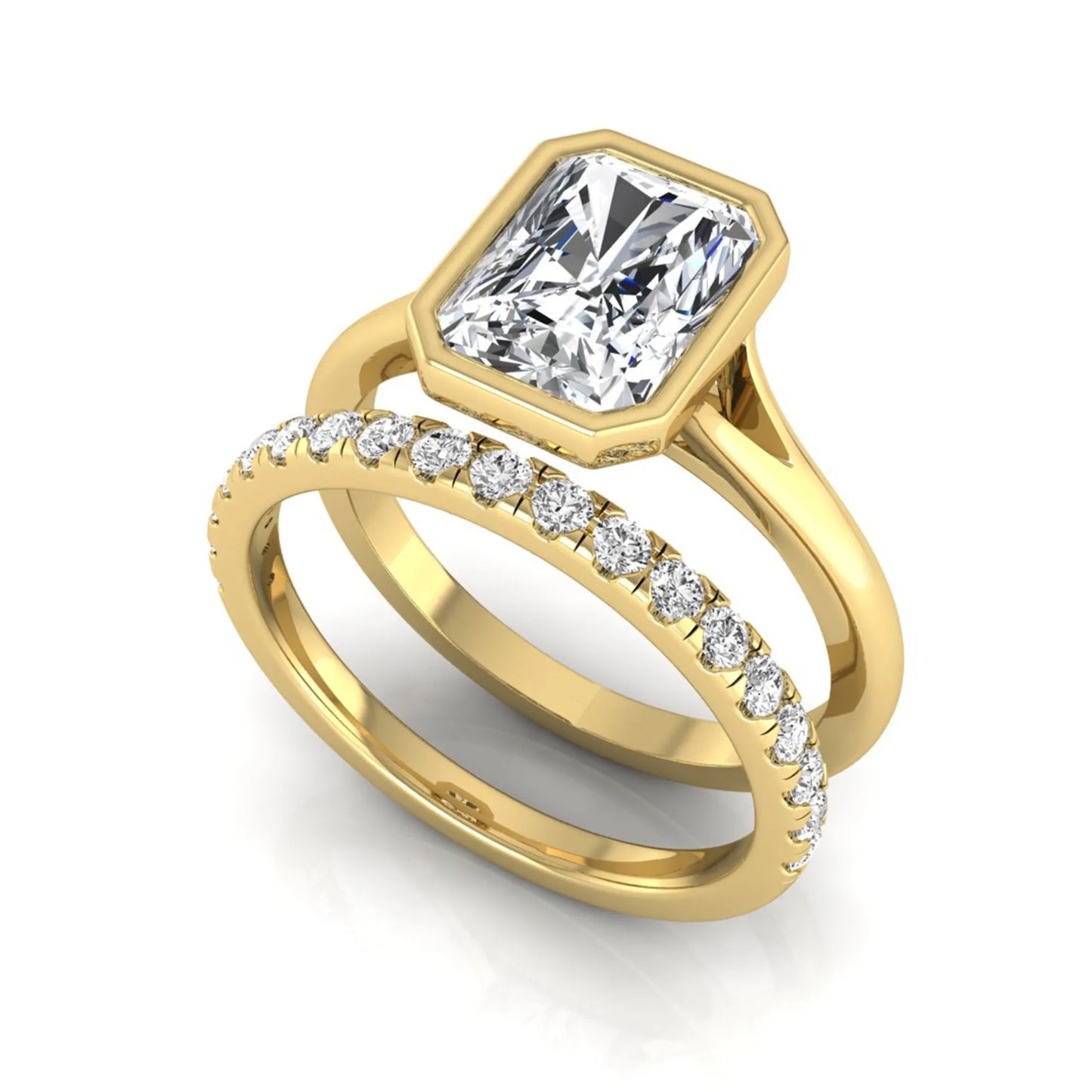 Radiant cut bezel set lab grown diamond bridal ring set with pavé contour band and yellow gold metal tone.