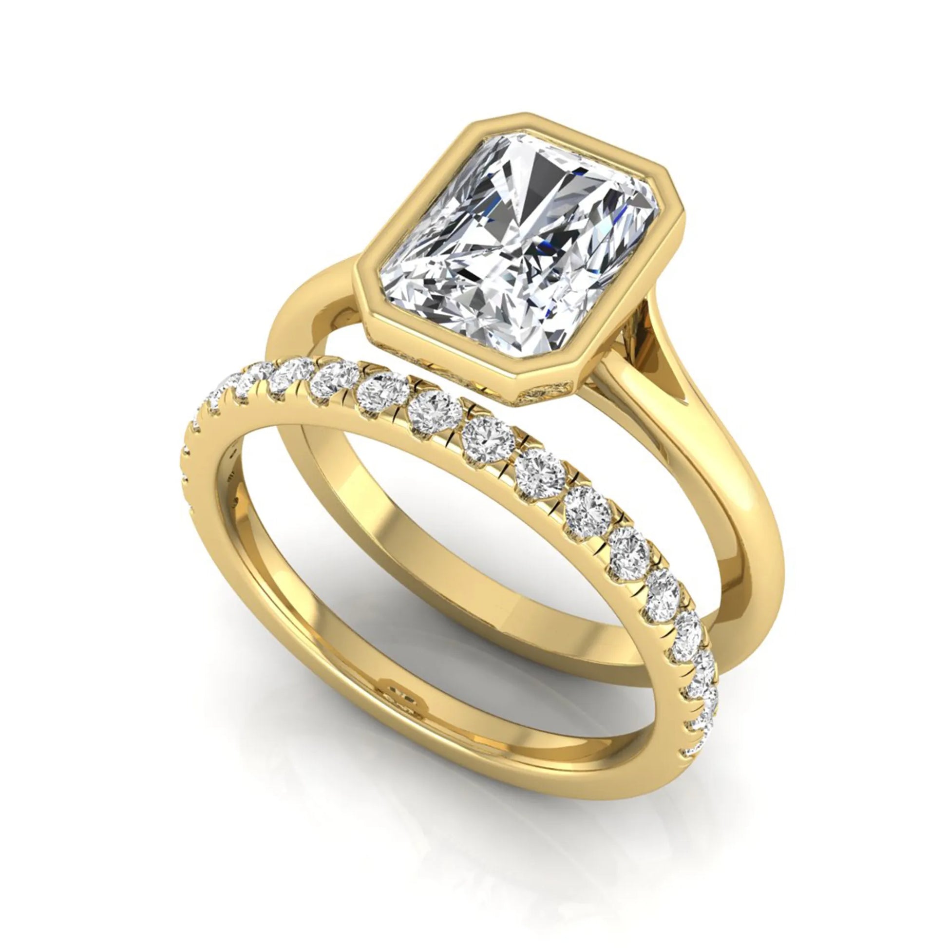 Radiant cut bezel set lab grown diamond bridal ring set with pavé contour band and yellow gold metal tone.