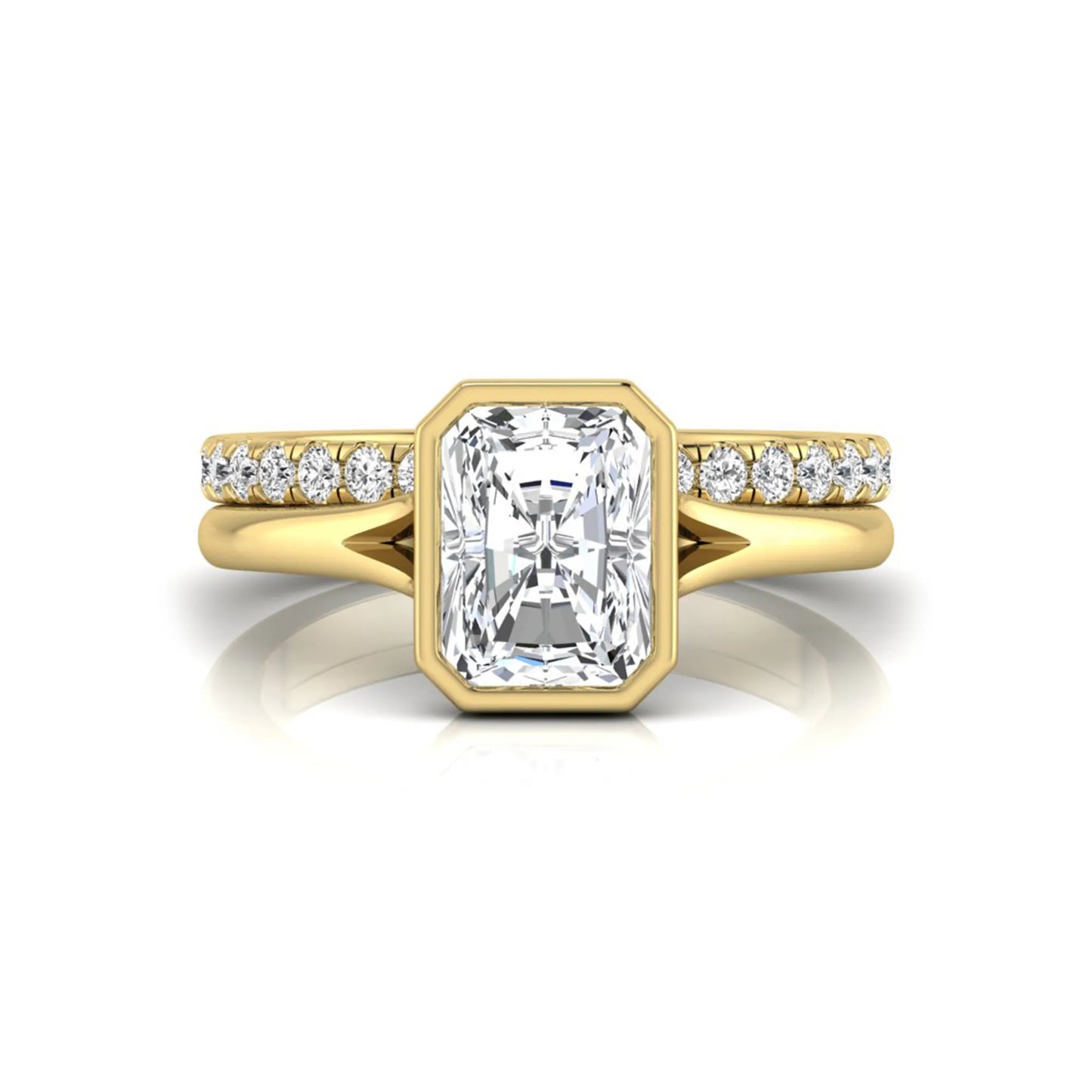 Radiant cut bezel set lab grown diamond bridal ring set with pavé contour band and yellow gold metal tone.