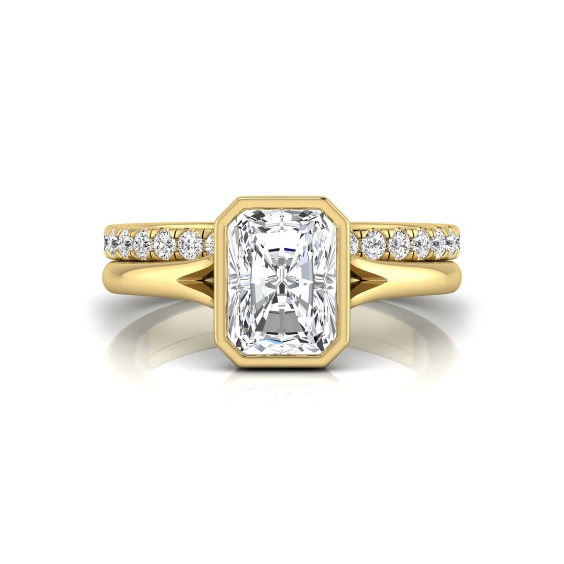 Radiant cut bezel set lab grown diamond bridal ring set with pavé contour band and yellow gold metal tone.