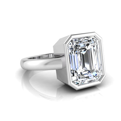 Radiant cut bezel set lab grown diamond solitaire engagement ring with a white gold tone band featuring an IGI certified center diamond.