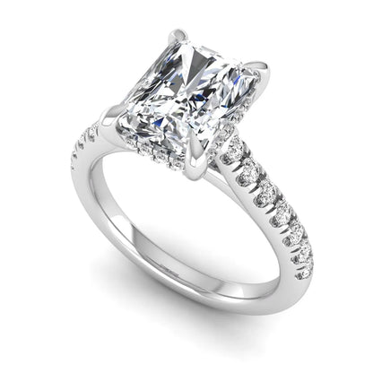 Radiant cut lab grown diamond hidden halo engagement ring with pavé diamond band and cathedral setting in white gold.