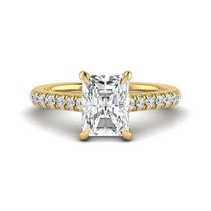 Radiant cut lab grown diamond hidden halo engagement ring with pavé diamond band and cathedral setting in yellow gold.