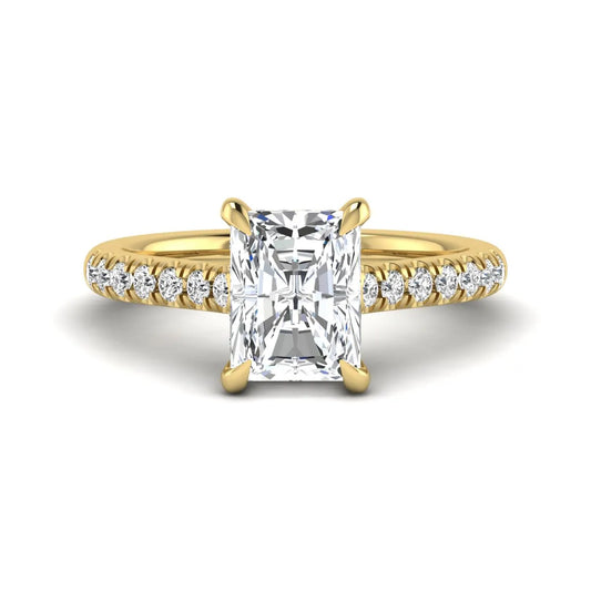 Radiant cut lab grown diamond hidden halo engagement ring with pavé diamond band and cathedral setting in yellow gold.