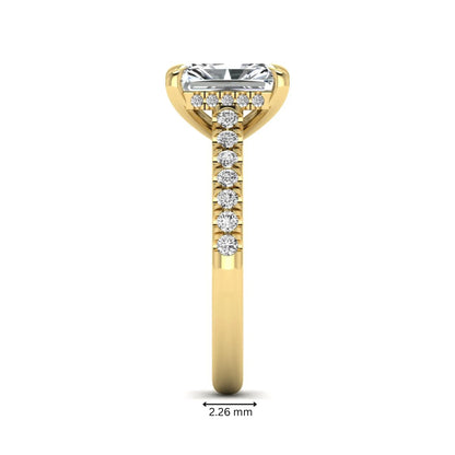 Radiant cut lab grown diamond hidden halo engagement ring with pavé diamond band and cathedral setting in yellow gold.