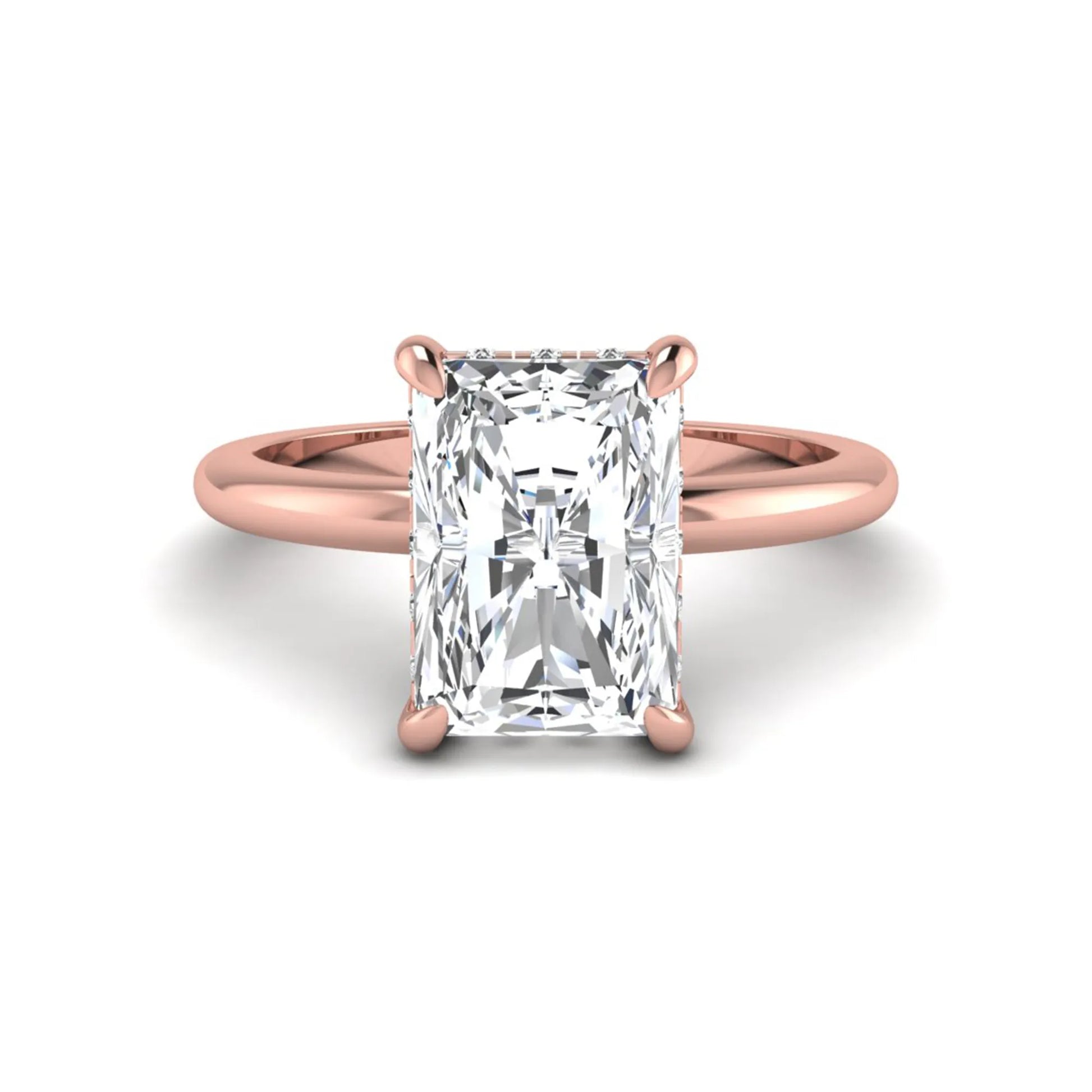 IGI certified radiant cut lab grown diamond hidden halo solitaire engagement ring in rose gold with a four-prong setting.