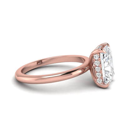 IGI certified radiant cut lab grown diamond hidden halo solitaire engagement ring in rose gold with a four-prong setting.