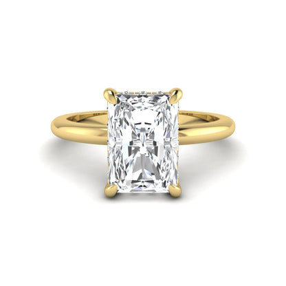 IGI certified radiant cut lab grown diamond hidden halo solitaire engagement ring in yellow gold with a four-prong setting.
