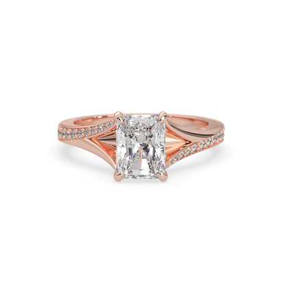 Rose gold ring with an emerald cut lab grown diamond on a white background