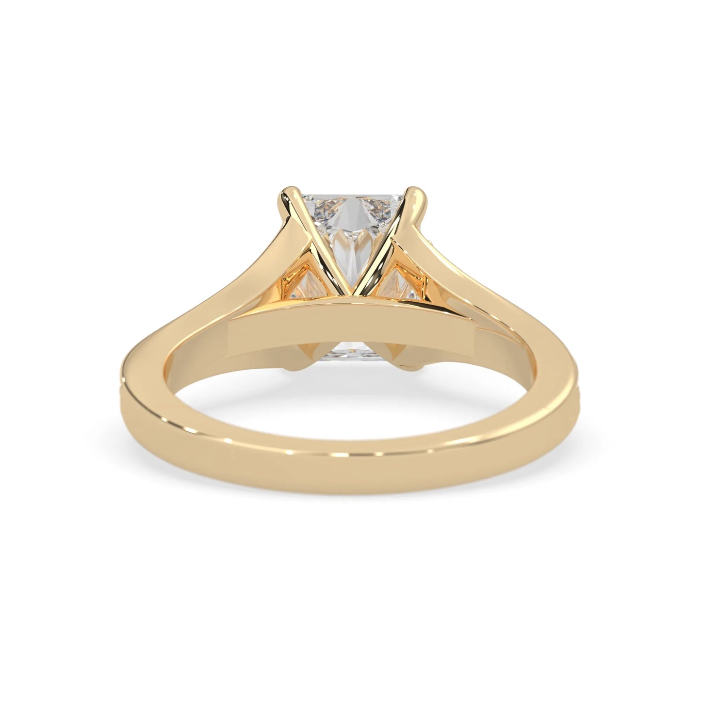 yellow Gold ring with a lab grown diamond on a white background