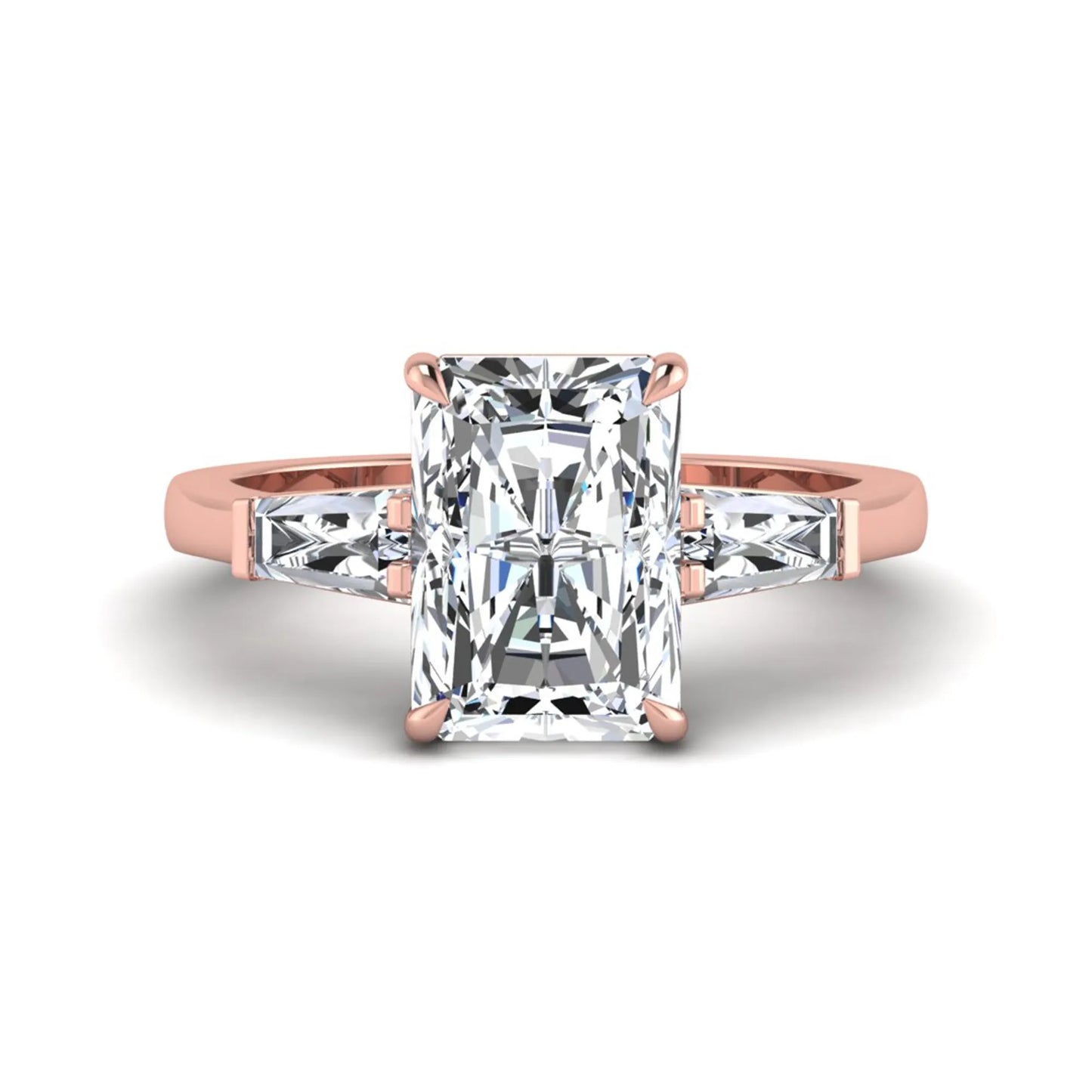Radiant cut lab grown diamond three stone engagement ring with tapered baguette side diamonds and four prong setting in rose gold tone.