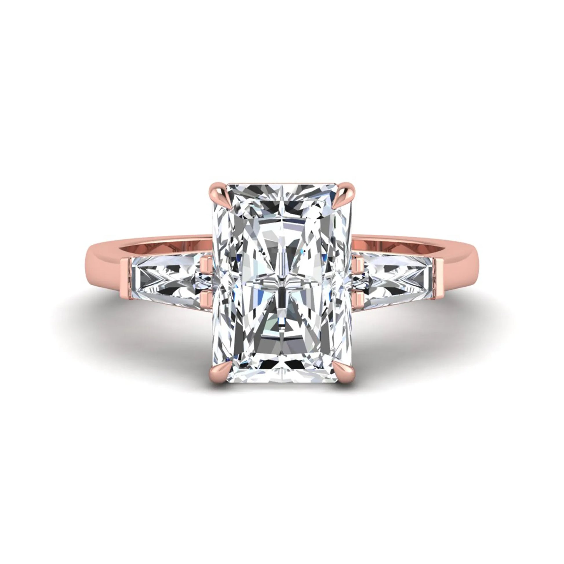 Radiant cut lab grown diamond three stone engagement ring with tapered baguette side diamonds and four prong setting in rose gold tone.