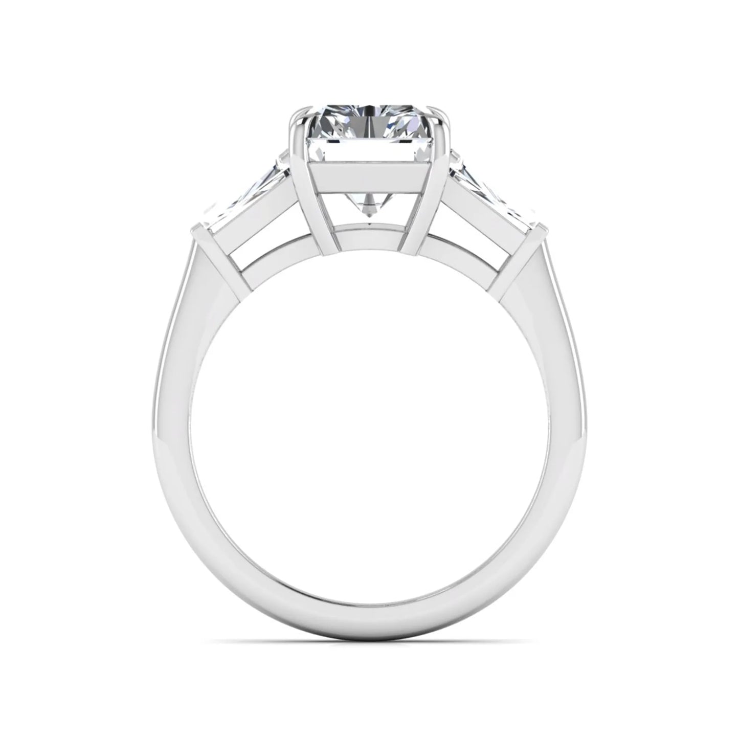 Radiant cut lab grown diamond three stone engagement ring with tapered baguette side diamonds and four prong setting in white gold tone.