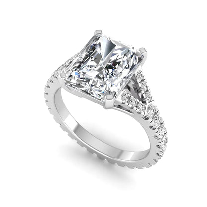 Radiant cut lab grown diamond split shank engagement ring with round accent diamonds in white gold