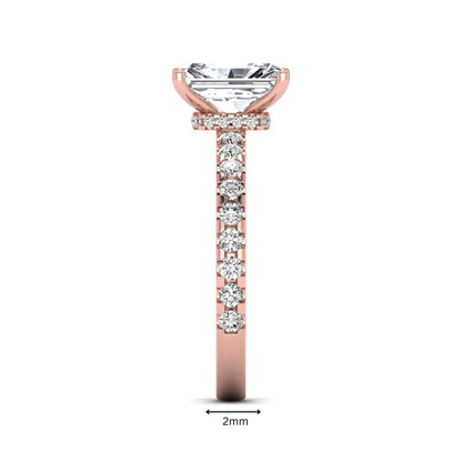 Radiant cut lab grown diamond hidden halo engagement ring featuring a four prong setting with pavé round diamond band in rose gold tone.