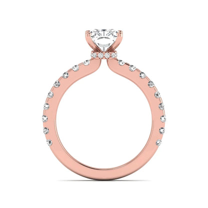 Radiant cut lab grown diamond hidden halo engagement ring featuring a four prong setting with pavé round diamond band in rose gold tone.