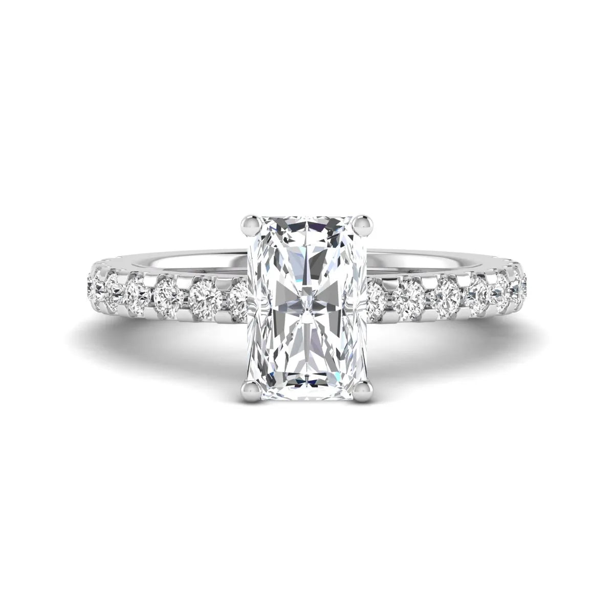 Radiant cut lab grown diamond hidden halo engagement ring featuring a four prong setting with pavé round diamond band in white gold tone.