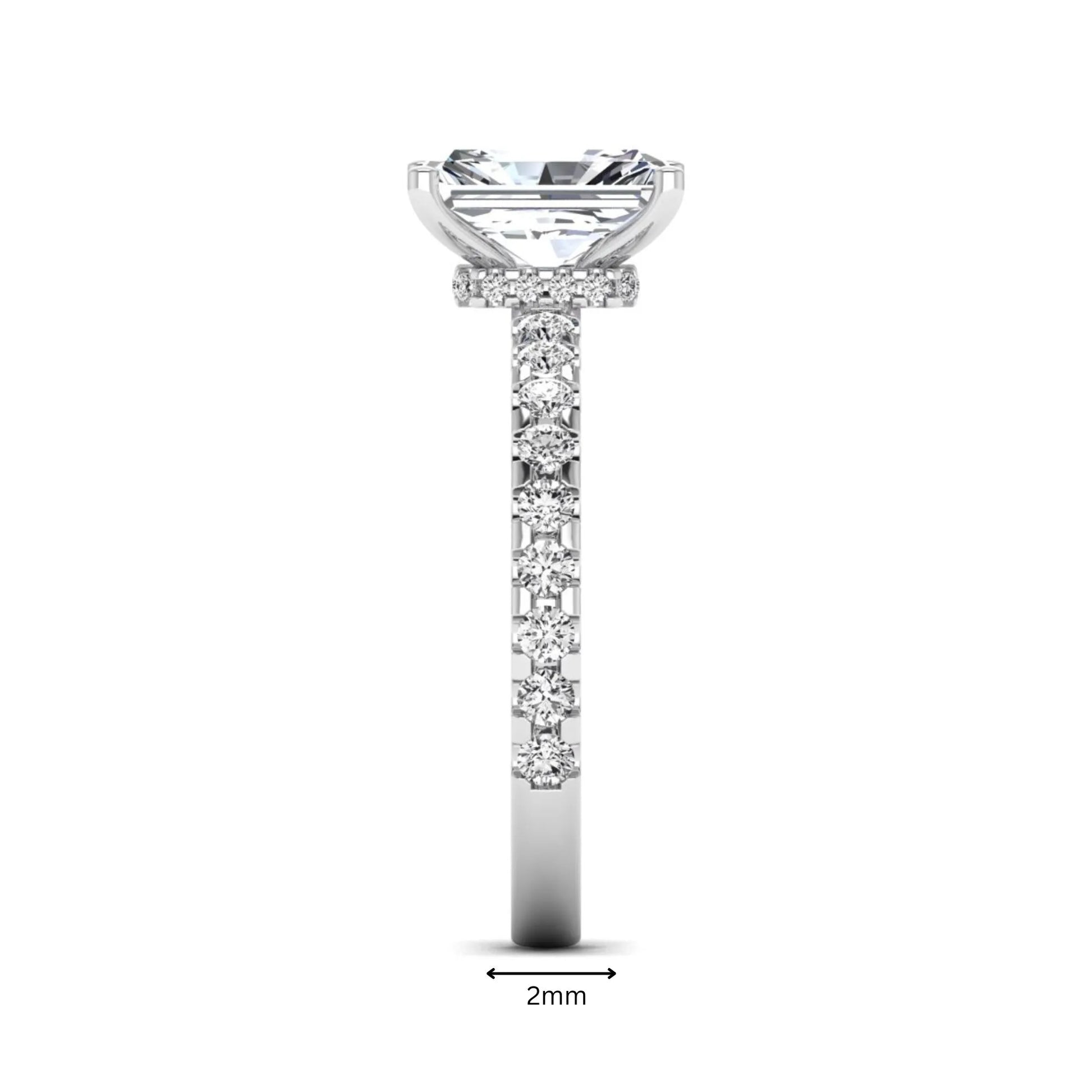 Radiant cut lab grown diamond hidden halo engagement ring featuring a four prong setting with pavé round diamond band in white gold tone.