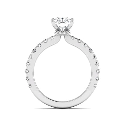 Radiant cut lab grown diamond hidden halo engagement ring featuring a four prong setting with pavé round diamond band in white gold tone.