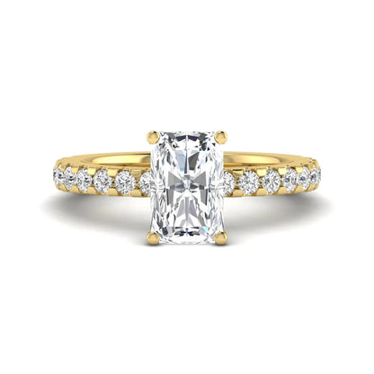 Radiant cut lab grown diamond hidden halo engagement ring featuring a four prong setting with pavé round diamond band in yellow gold tone.