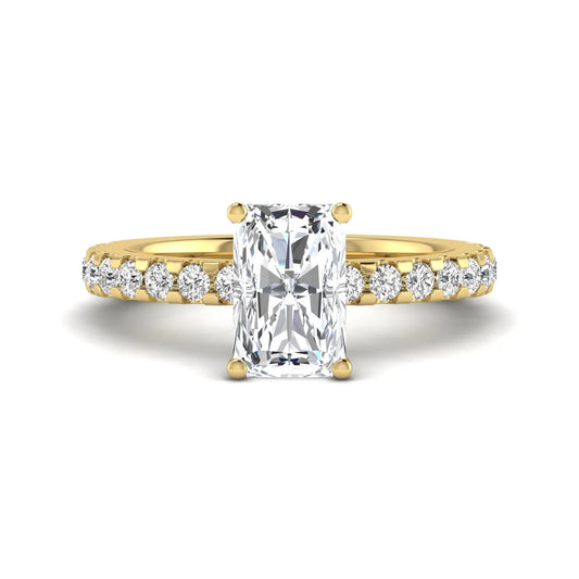 Radiant cut lab grown diamond hidden halo engagement ring featuring a four prong setting with pavé round diamond band in yellow gold tone.
